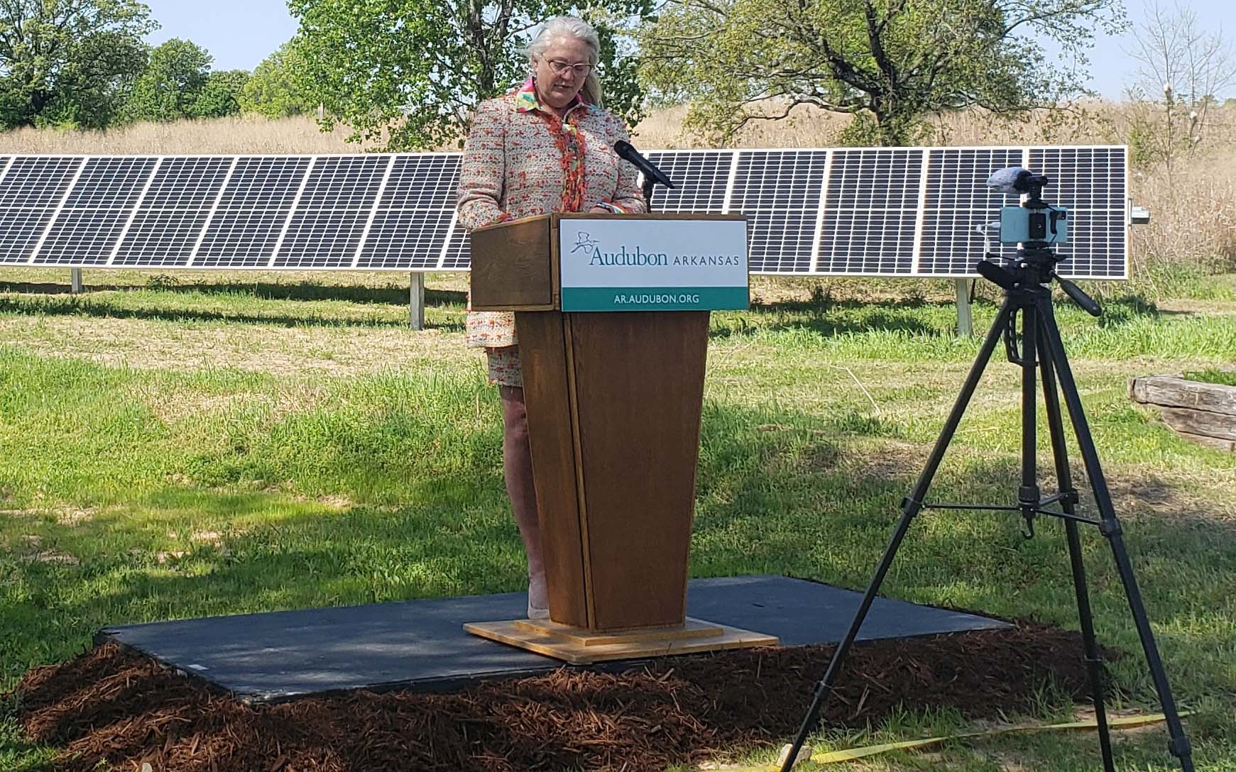  Anna Riggs, board chair of Audubon Arkansas, announces the completion of the Arkansas conservation group's new 35-kilowatt solar power plant.